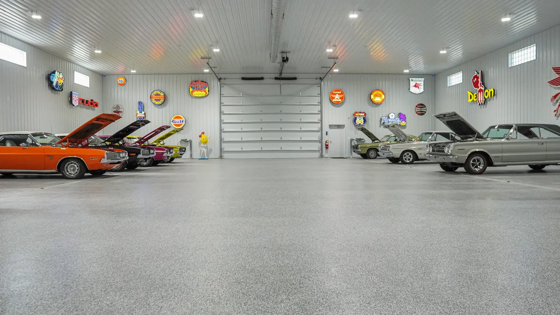 garage floor coating with classic cars hoods up