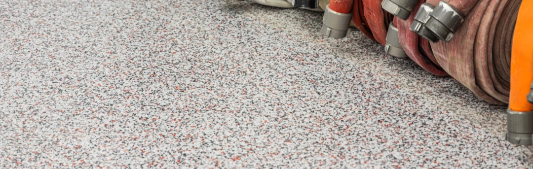 floor coating with hoses curled up