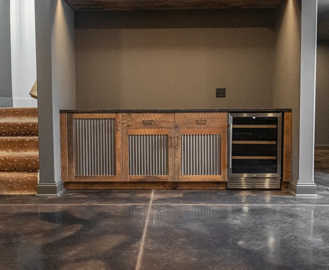 basement floor coating cabinets and mini fridge