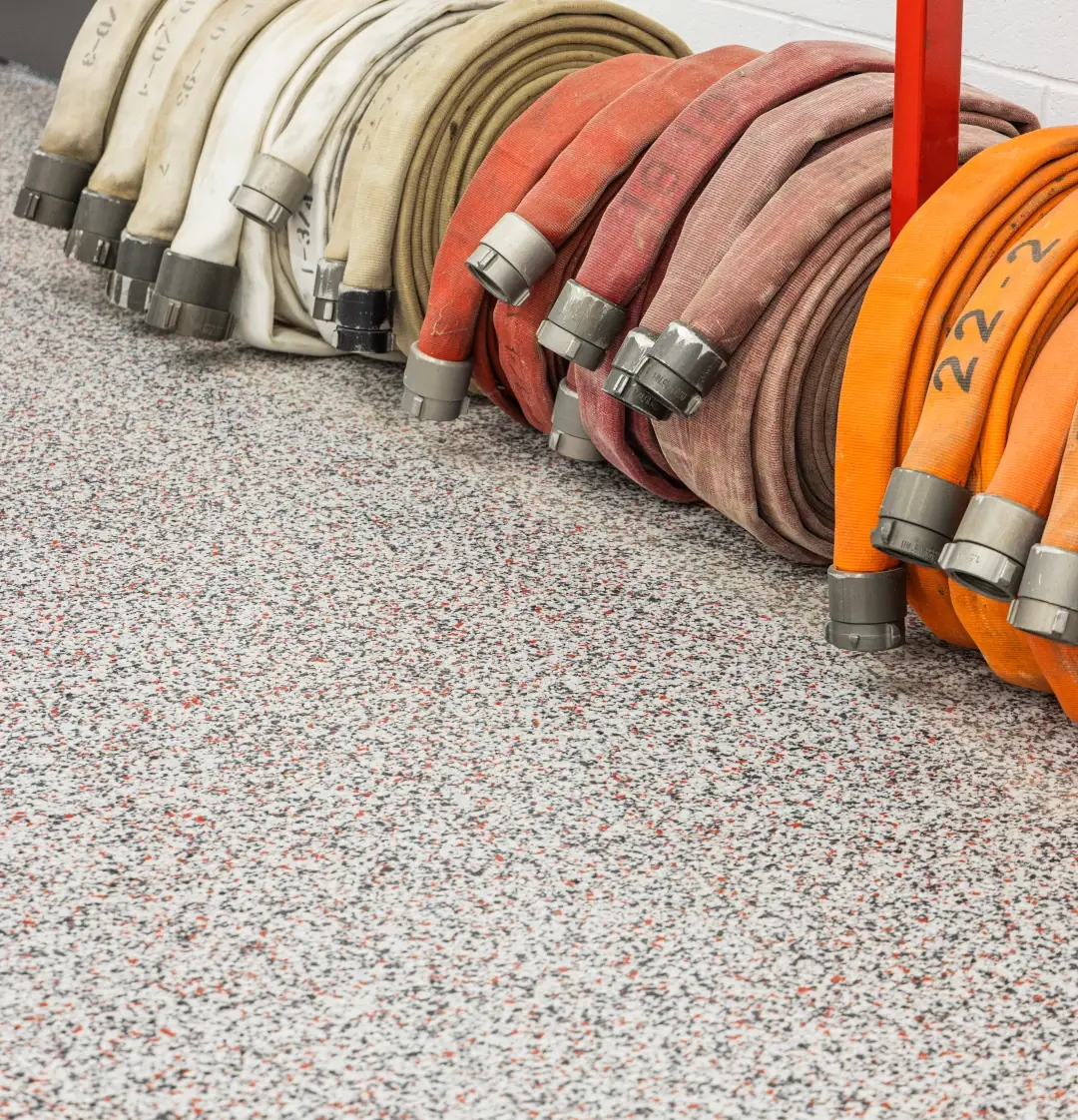 fire hoses sitting on coated floors