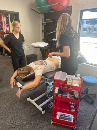 physical therapist performing hands-on manual therapy with patient