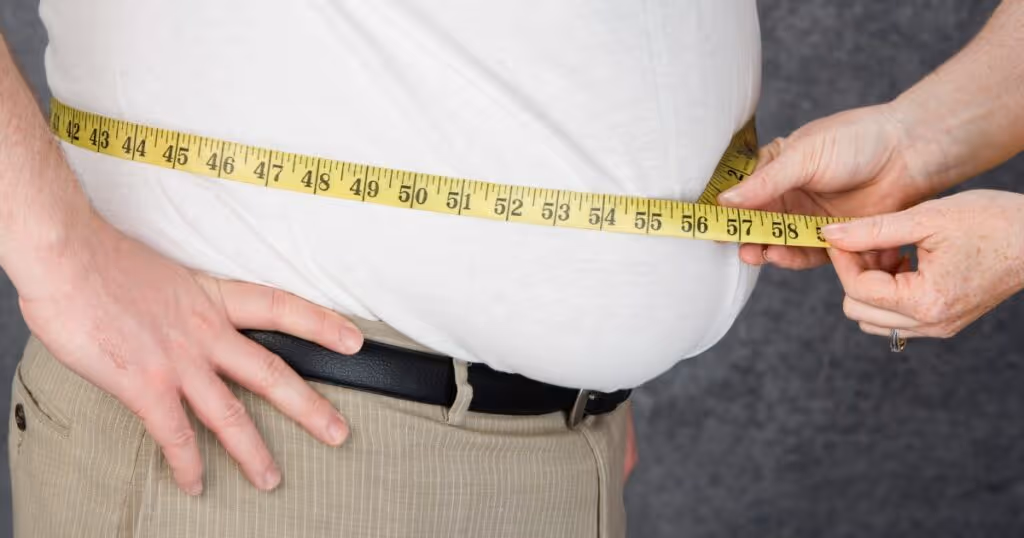 Doctor consulting with a Bangladeshi patient about obesity management and treatment options at Apollo Hospitals India.