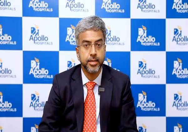 Doctor explaining how a cochlear implant helps children with severe hearing loss develop speech and language skills.