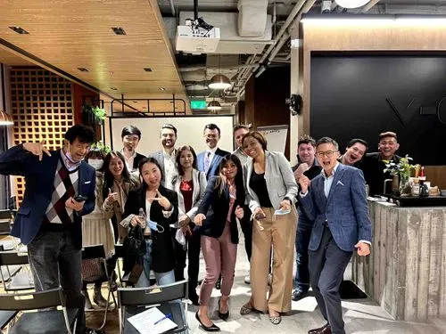 A cheerful group photo with everyone smiling brightly and radiating positive energy.