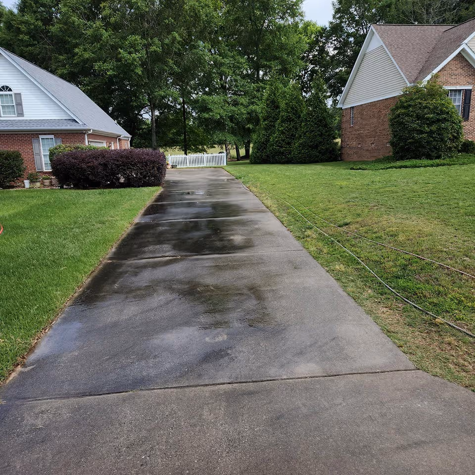 Driveway before pressure washing in Anderson County.