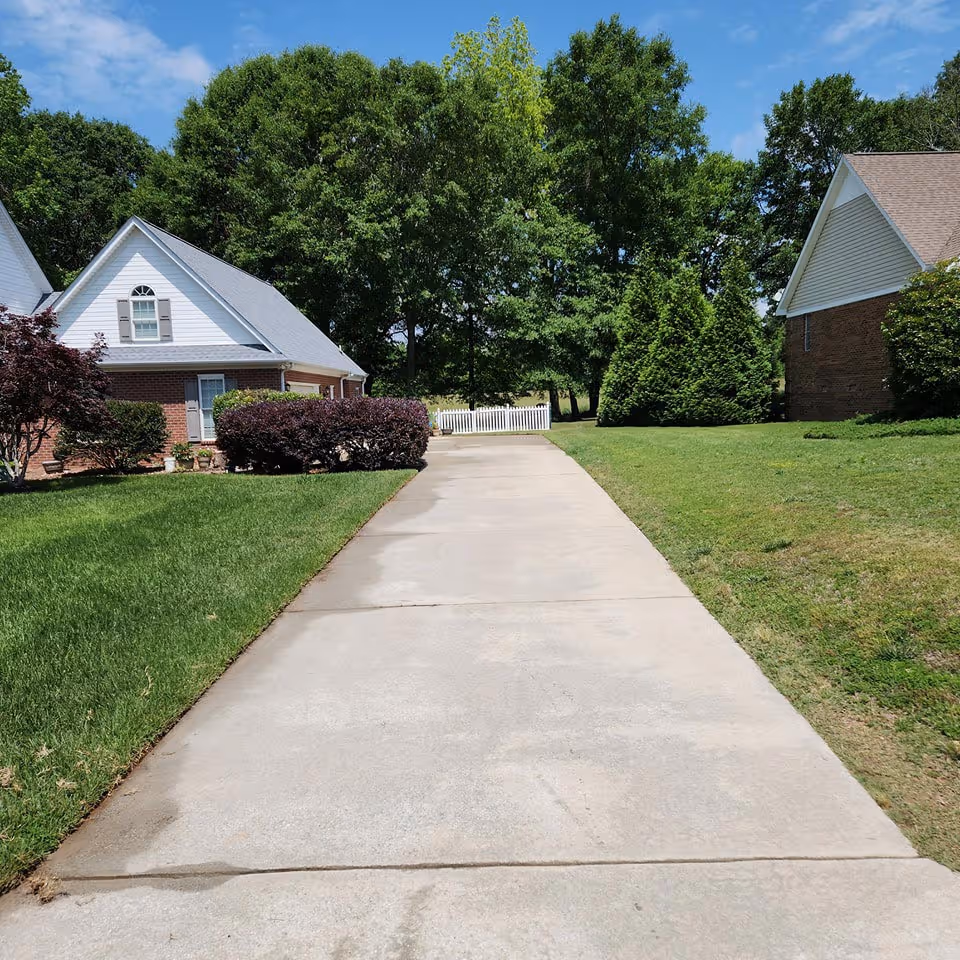Driveway after pressure washing in Anderson County.