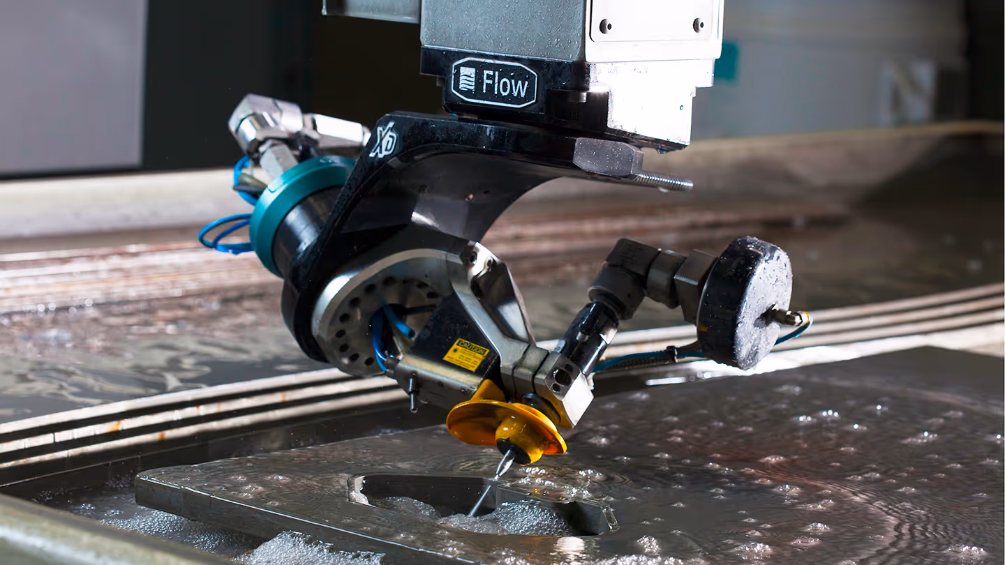 Close-up view of a five axis water jet cutting system head