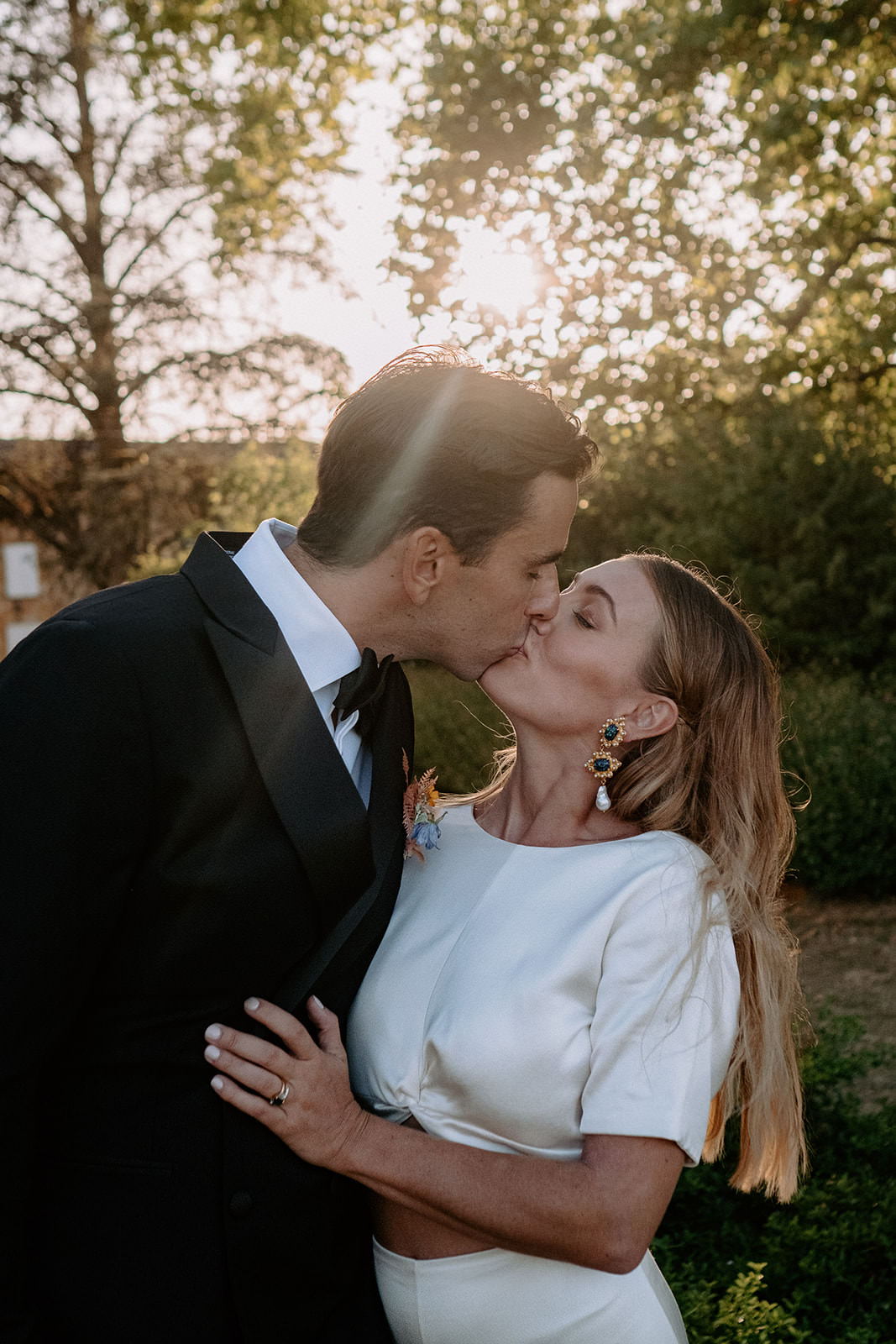 Couple kissing in golden evening light