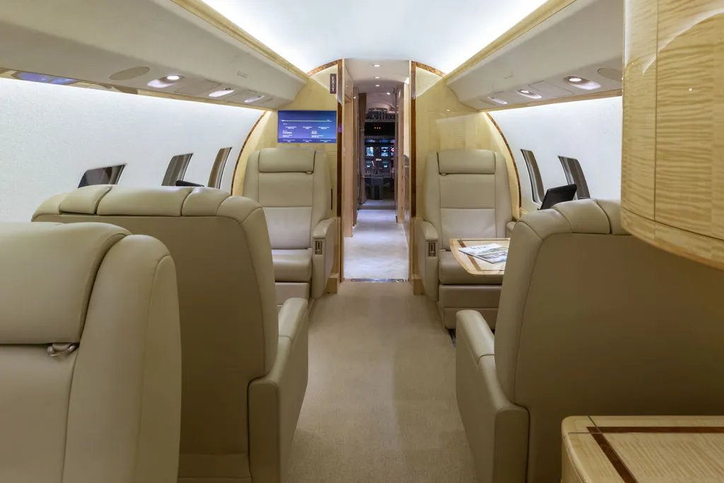 2002 Bombardier Global Express N983J S/N 9072 - interior aircraft - midway - forward facing club chairs, open cockpit door