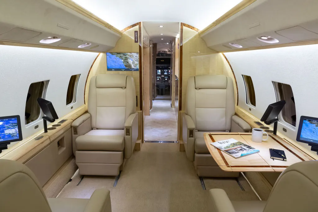 2002 Bombardier Global Express N983J S/N 9072 - interior aircraft - forward facing club chairs, open cockpit door