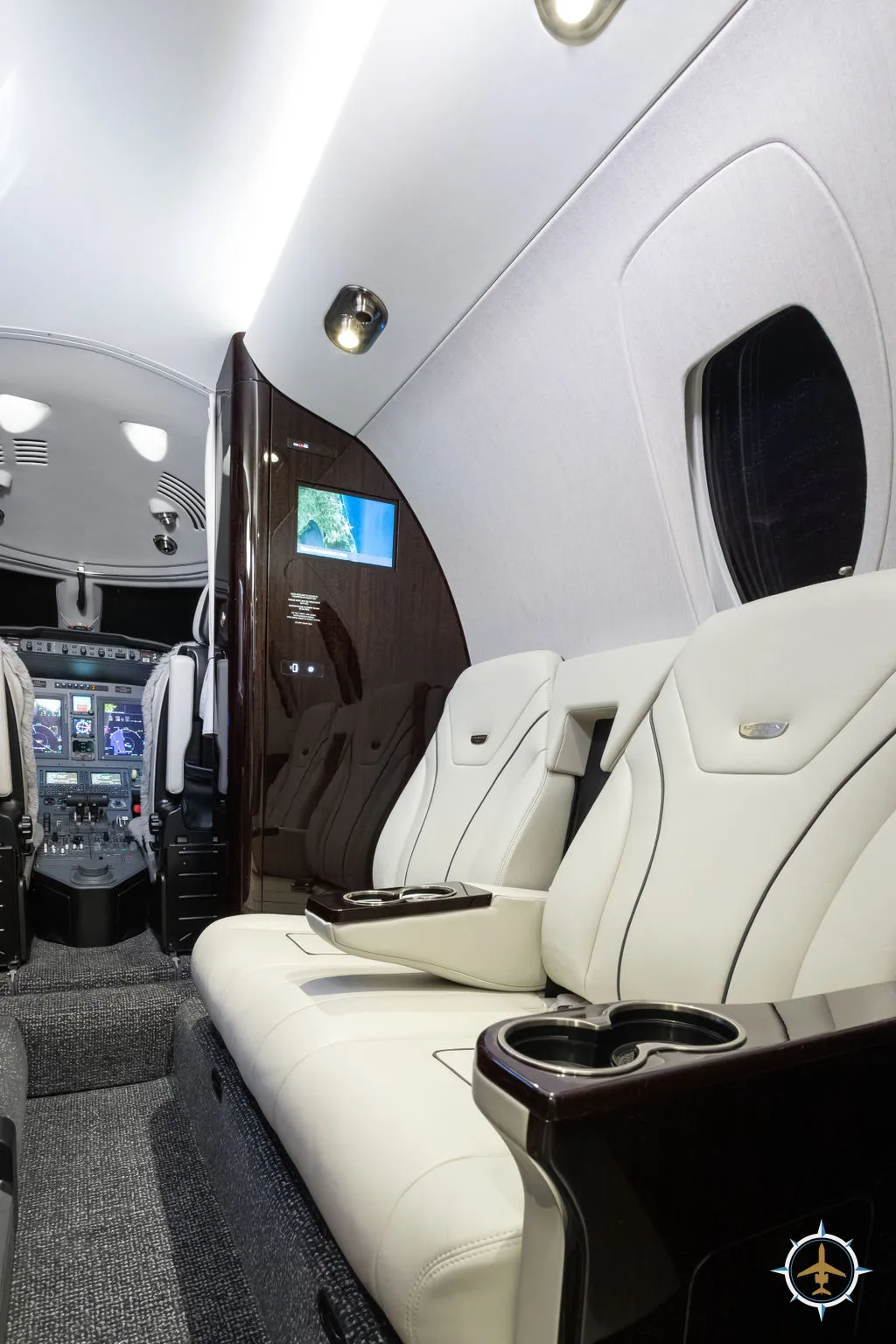 2024 Cessna Citation XLS Gen2 S/N 560-6360 - exterior of white and blue aircraft for sale, interior view of side facing seats, Mikolay Jet group logo
