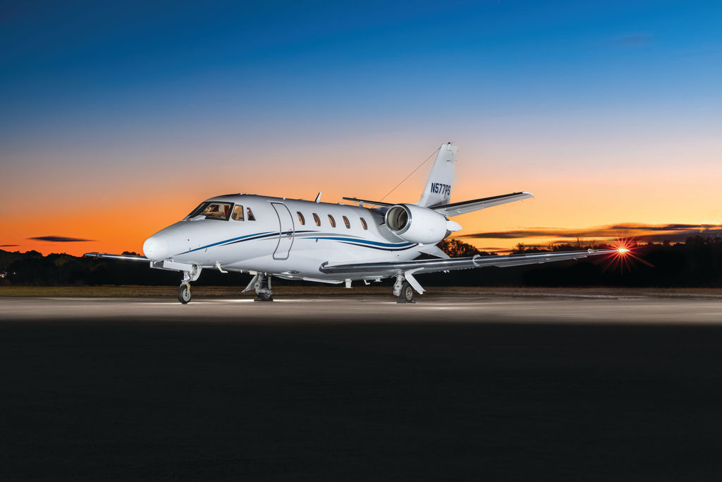 2005 Citation XLS S/N 560-5581 - exterior of white and blue aircraft for sale, parked on a ramp outside, Mikolay Jet group logo