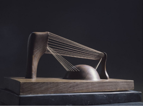 A wooden object with strings attached to itAI-generated content may be incorrect.