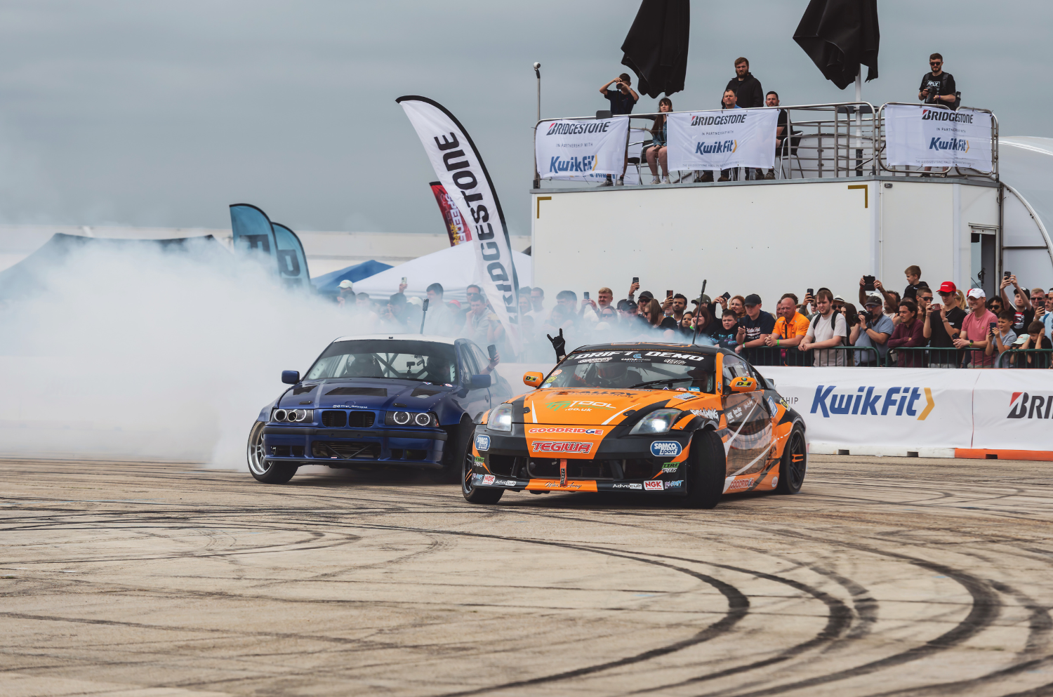 Drift cars underneath the Red Arrows