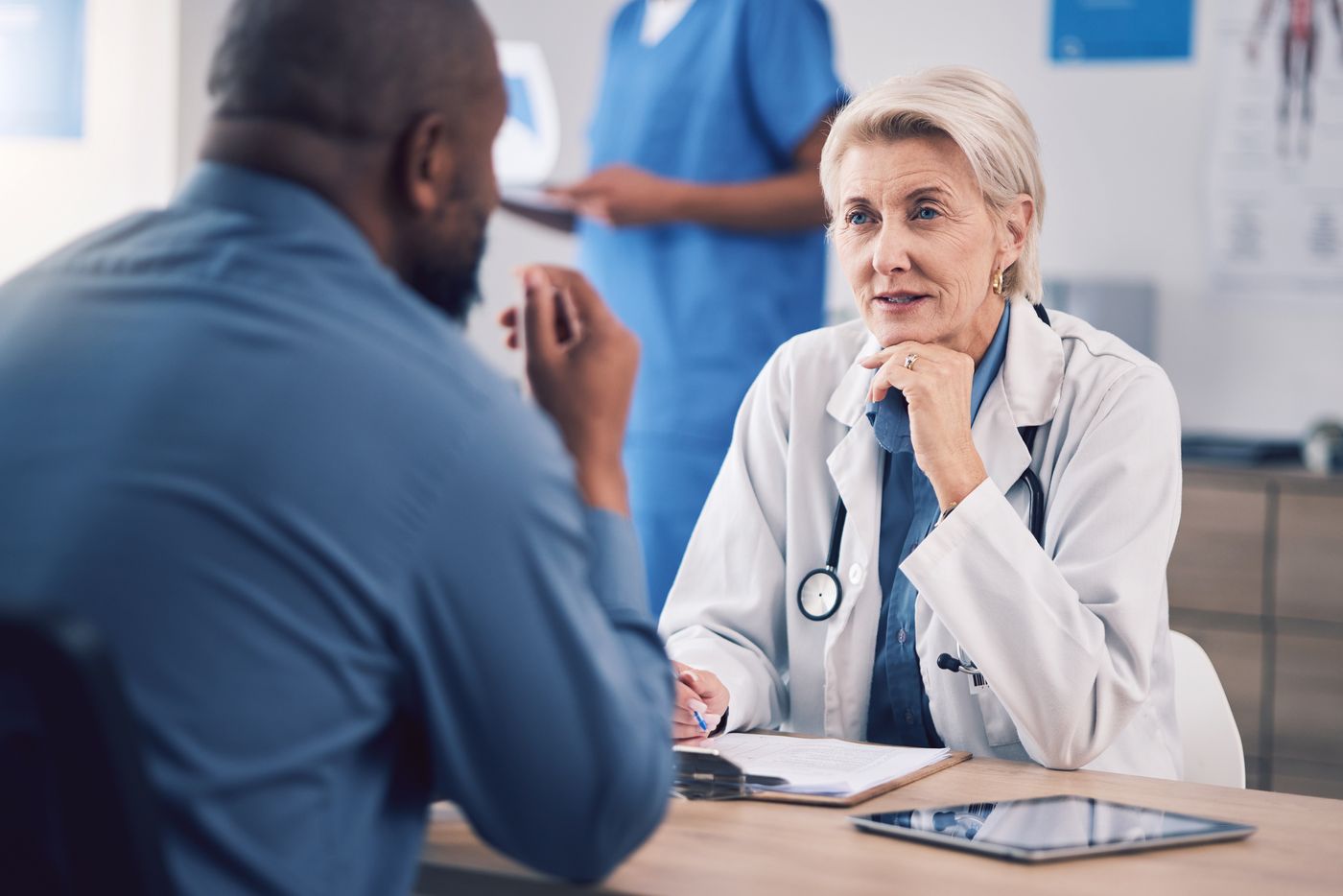 Doctor listening to a patient during a medical consultation