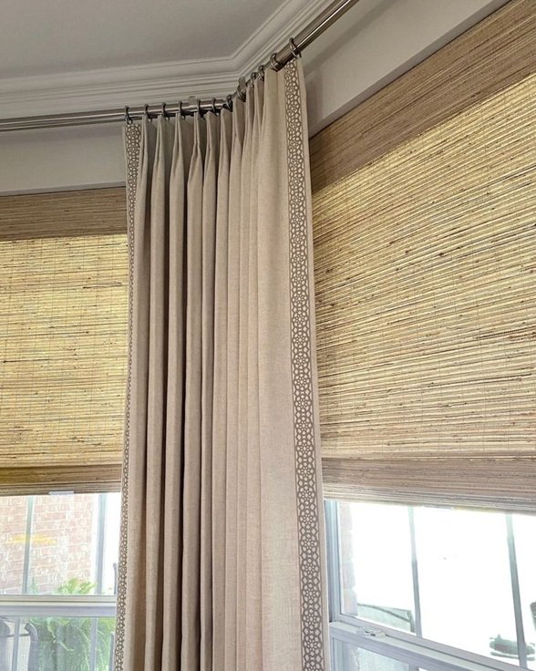 Layered woven shades with drapery panels, window coverings in University Park, TX