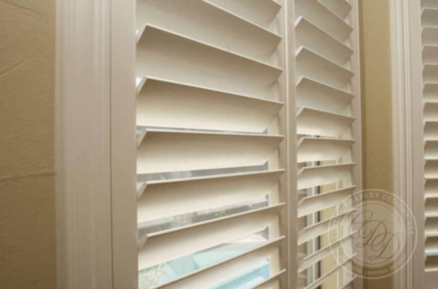 Close-up of durable white plantation shutters, window shutters in University Park, TX