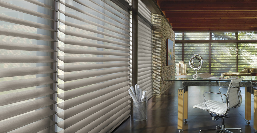 Horizontal window blinds enhance a sleek workspace interior in University Park, TX