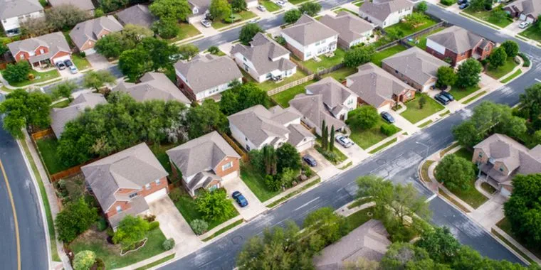 a birds eye view of a sterile suburban neighborhood.