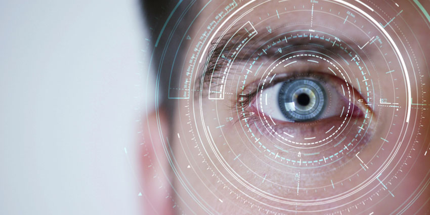 A photo of an eye with some artifacts in front of it.