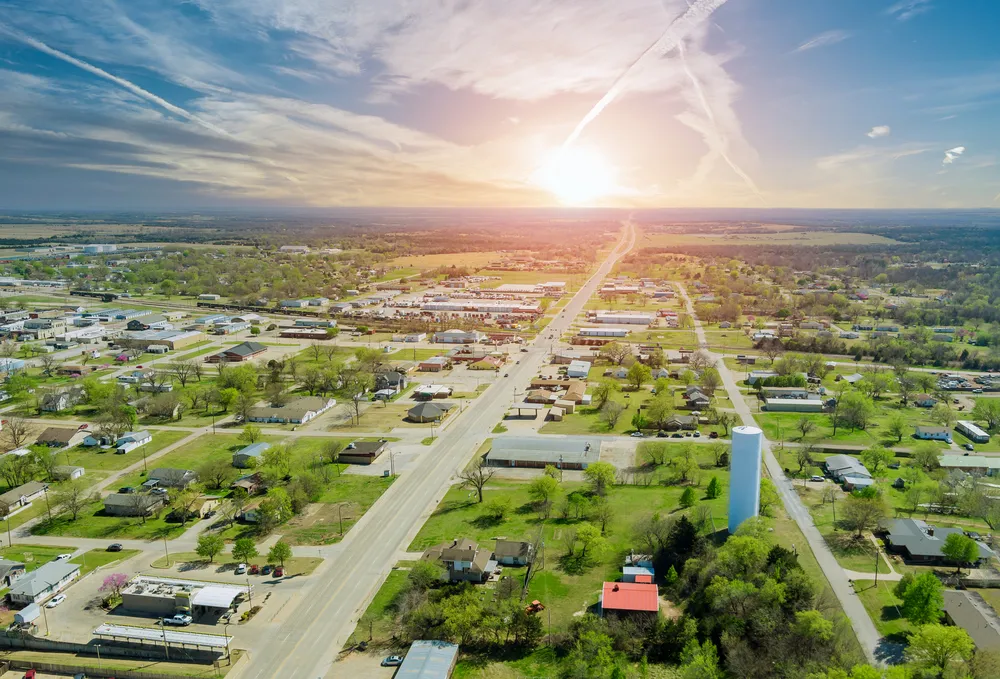 An aerial view of a rural Oklahoma town at sunset.