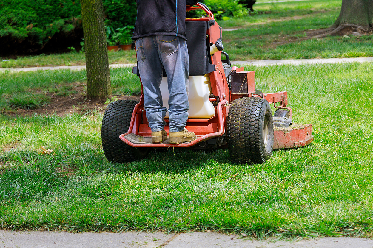Precision lawn mowing with clean edging on a residential property