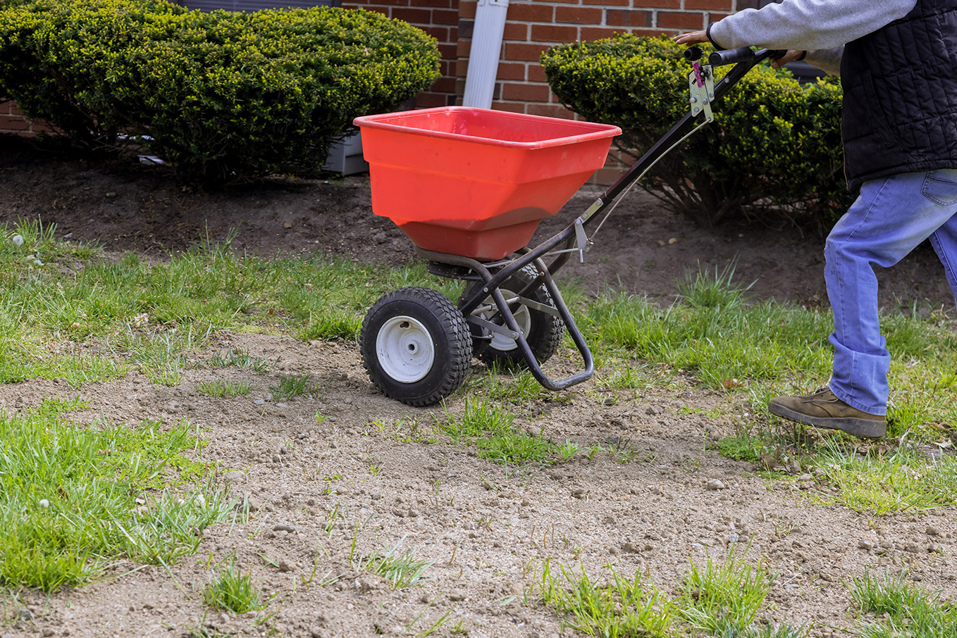 From The Soil lawn treatment crew fertilizing a residential yard in Cincinnati