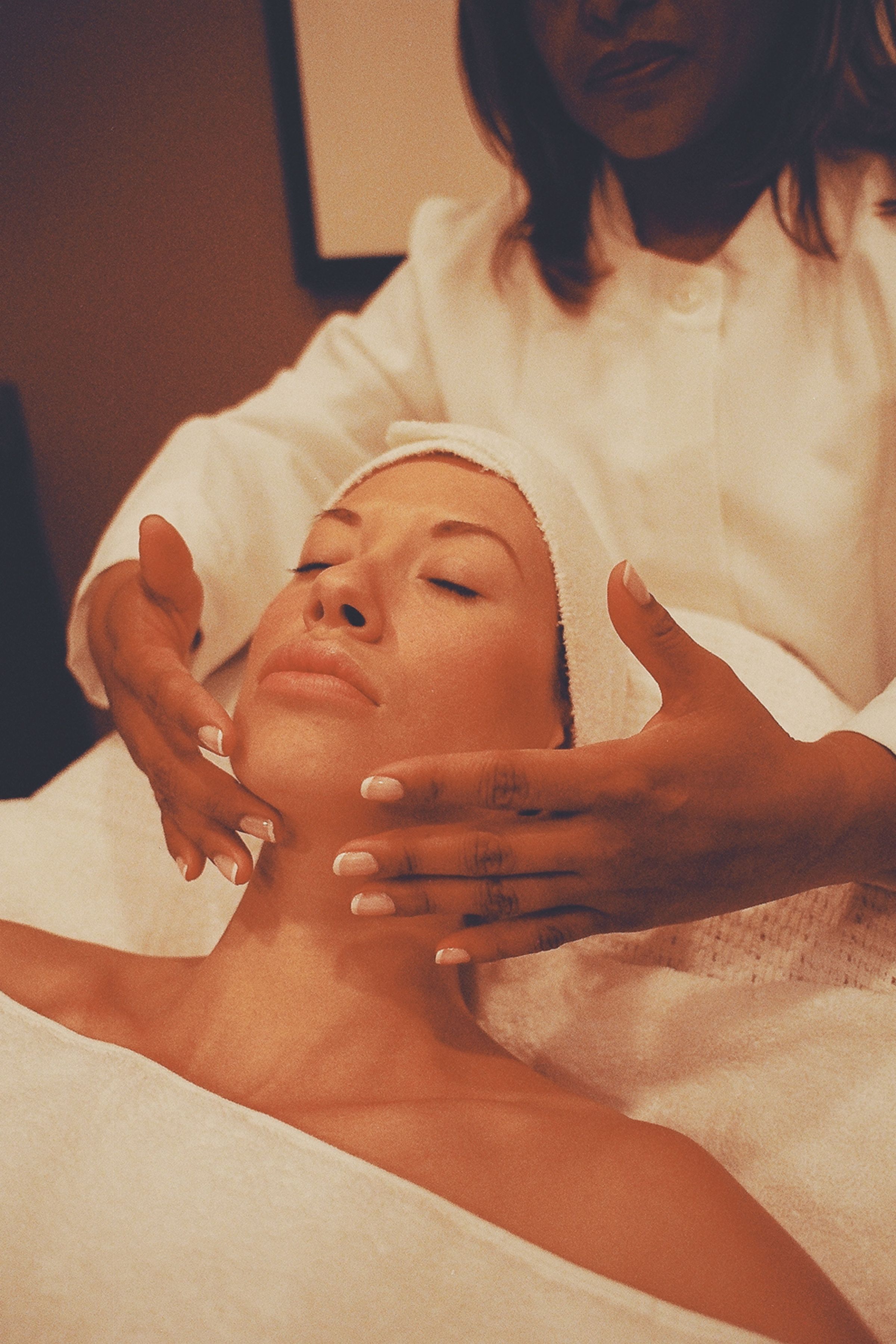 Client relaxing during a DEJ BioStim peel appointment at a Richardson TX medspa