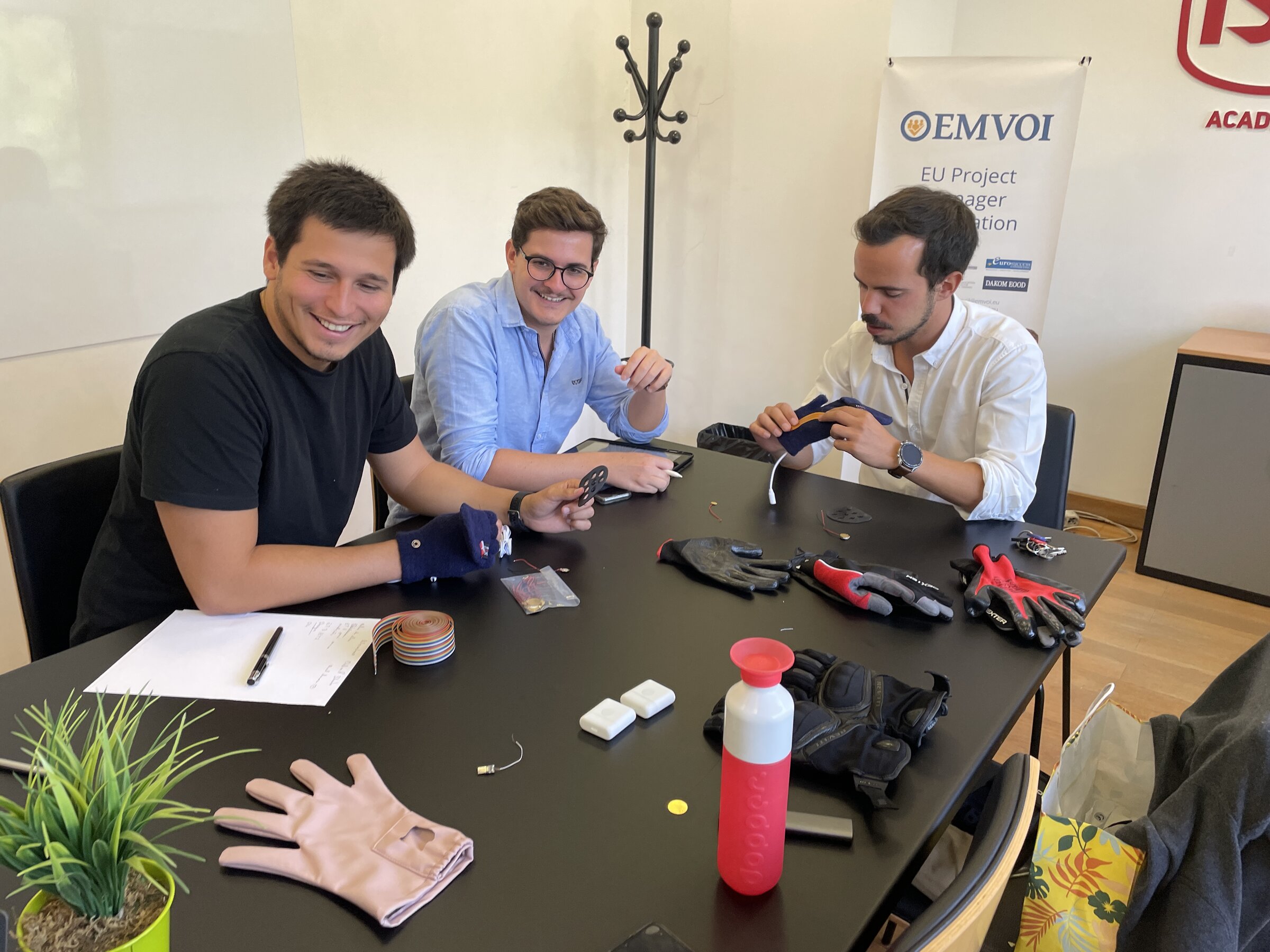 FullCycle and CleoCare teams reviewing glove prototypes