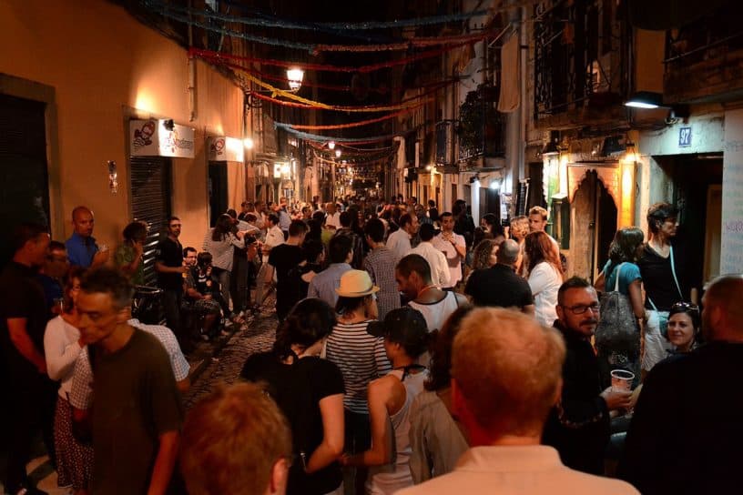 Crowded street at night in Bairro Alto, Lisbon