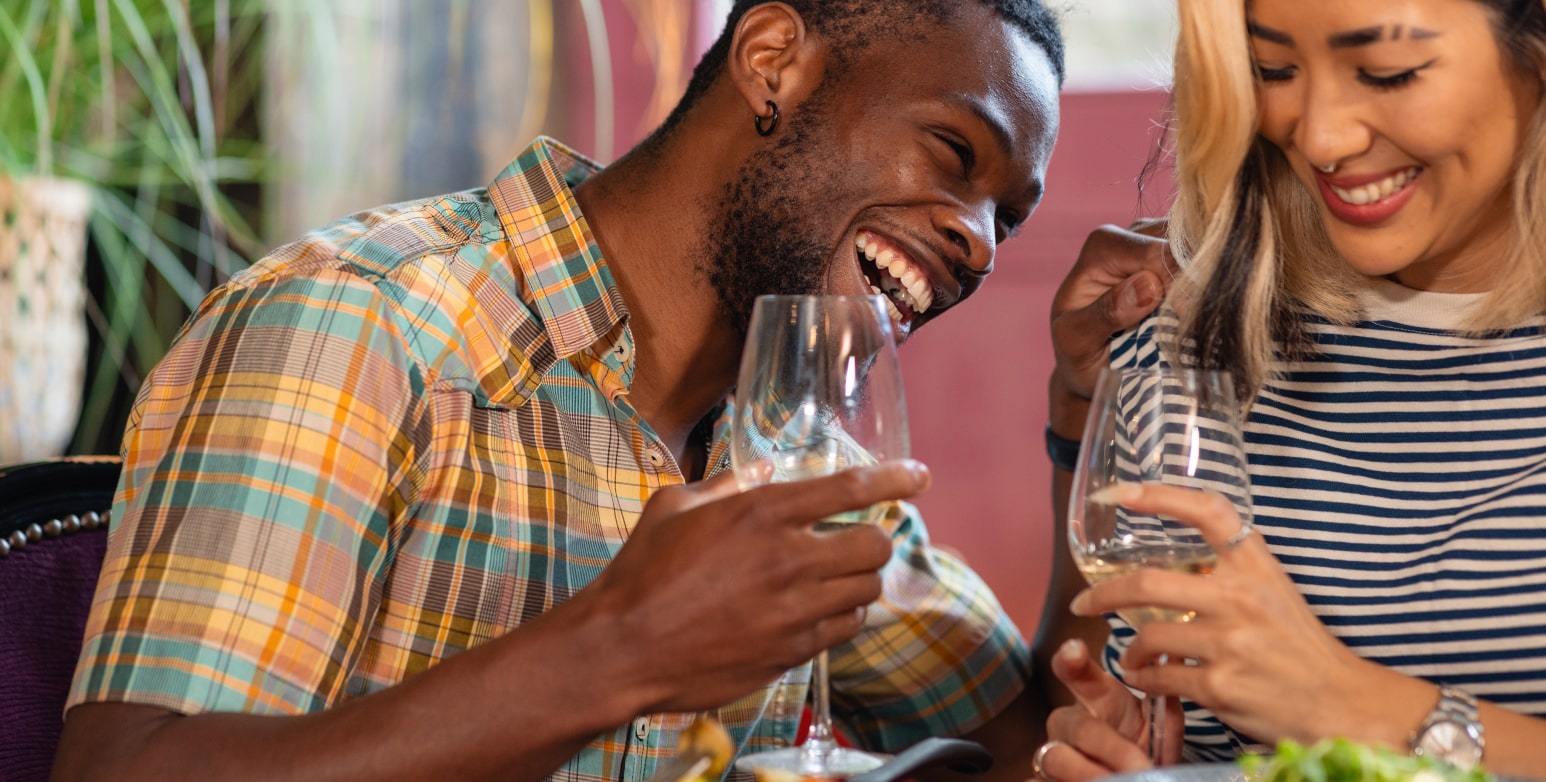 Man and woman enjoying drinks together