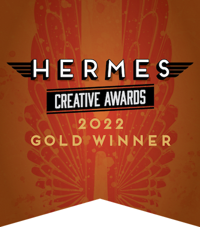 Hermes Creative Awards 2022 Gold Winner emblem on an orange background with winged design.