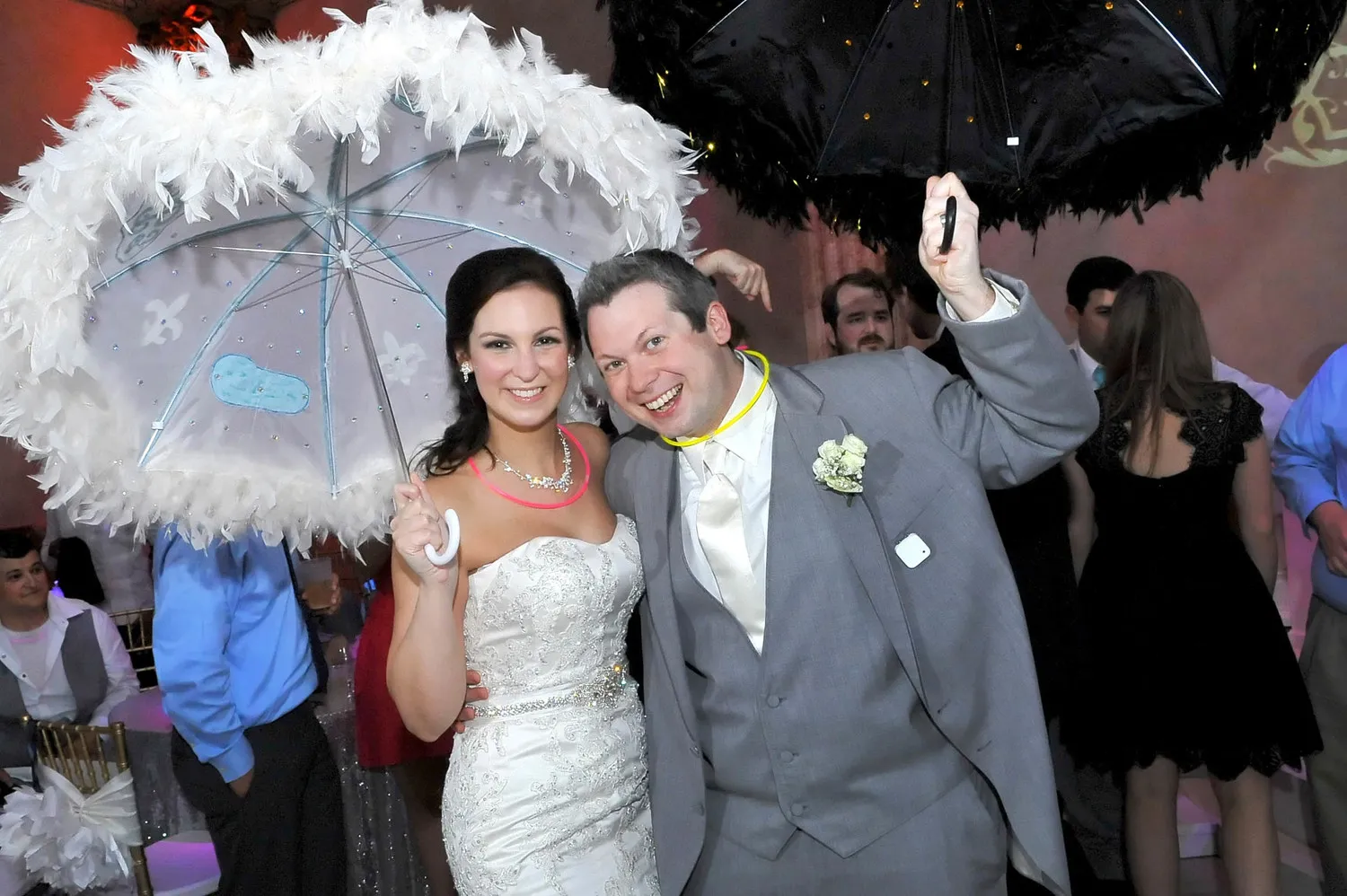 Bride and Groom dancing with an umbrellas