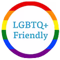 Rainbow-bordered circular badge with text 'LGBTQ+ Friendly' in blue.