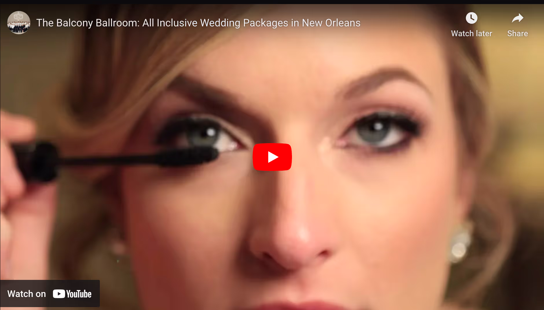 Woman applying mascara to her eyelashes in a close-up video thumbnail.