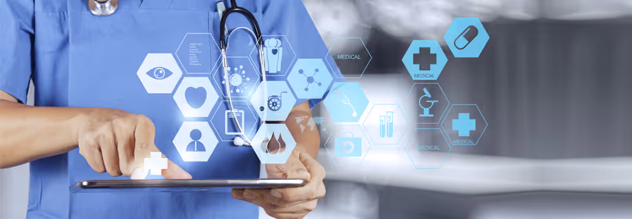 Healthcare worker in blue scrubs using a tablet with medical icons floating above the device.