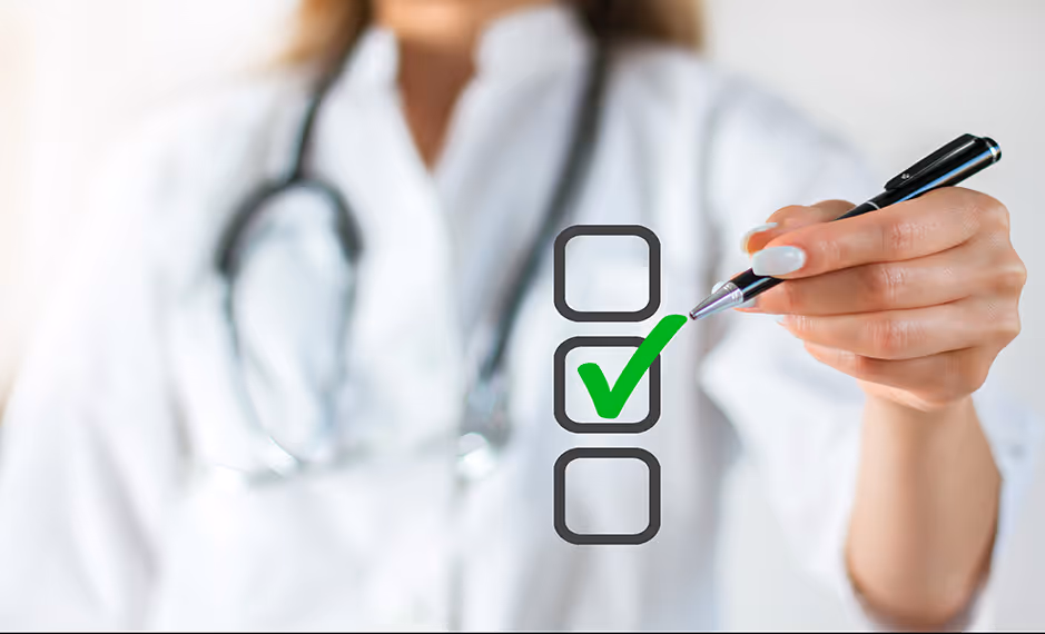 Doctor with stethoscope in white coat marking a green check in the middle of three checkboxes.
