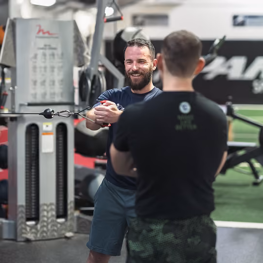 Client lifting weights during a strength training session at Evolve Training NJ