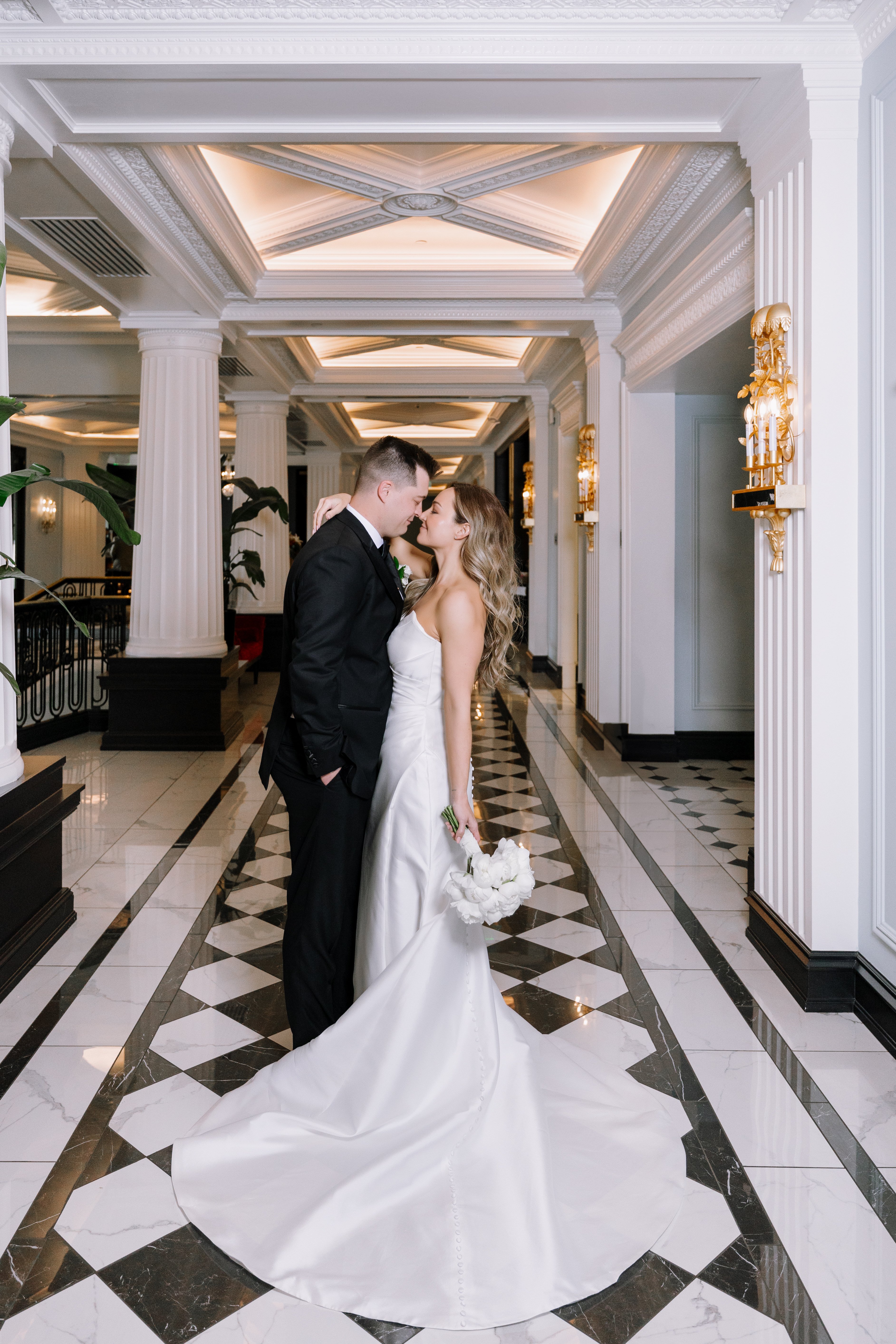 bride and groom kissing at hotel carmichael wedding