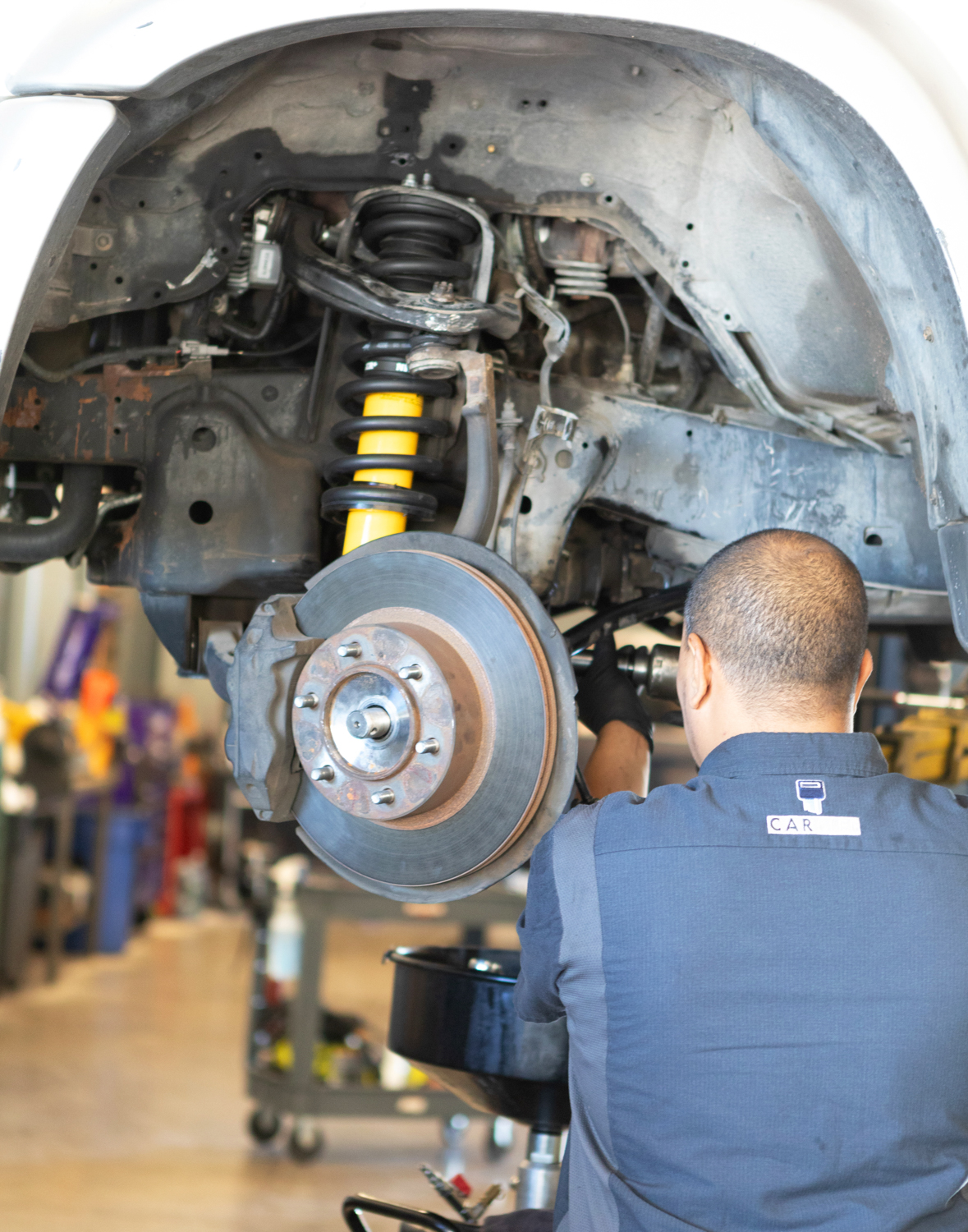 Car Life Technician Hanna running diagnostics on a vehicle