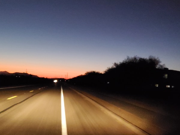 Multiple Car Life Technicians Servicing a Vehicle