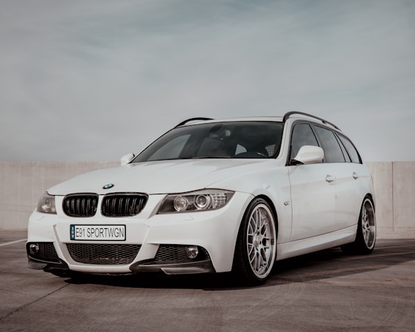 Multiple Car Life Technicians Servicing a Vehicle