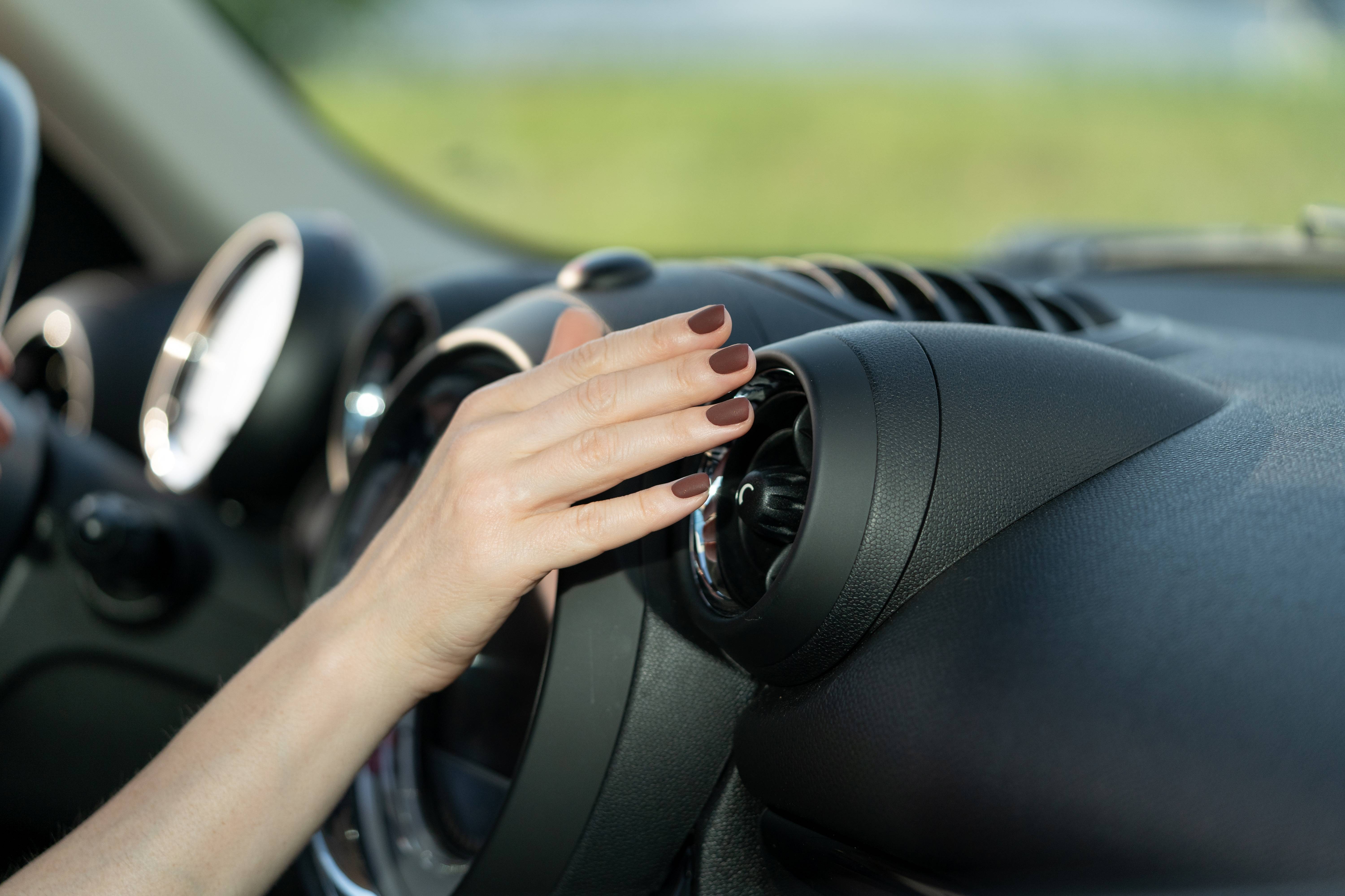 Multiple Car Life Technicians Servicing a Vehicle