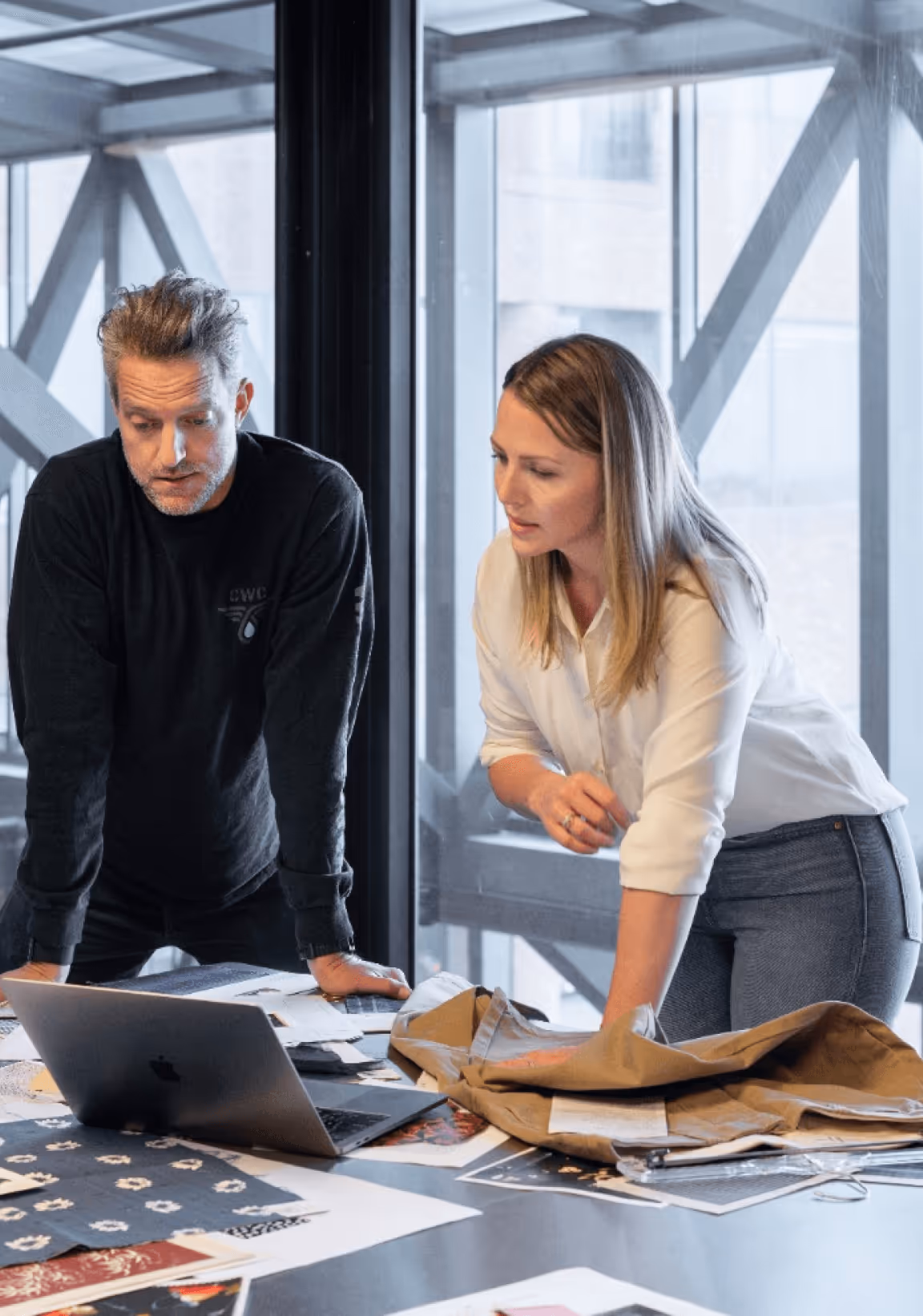 People on a meeting Planning calendar with campaign milestones – Guideline