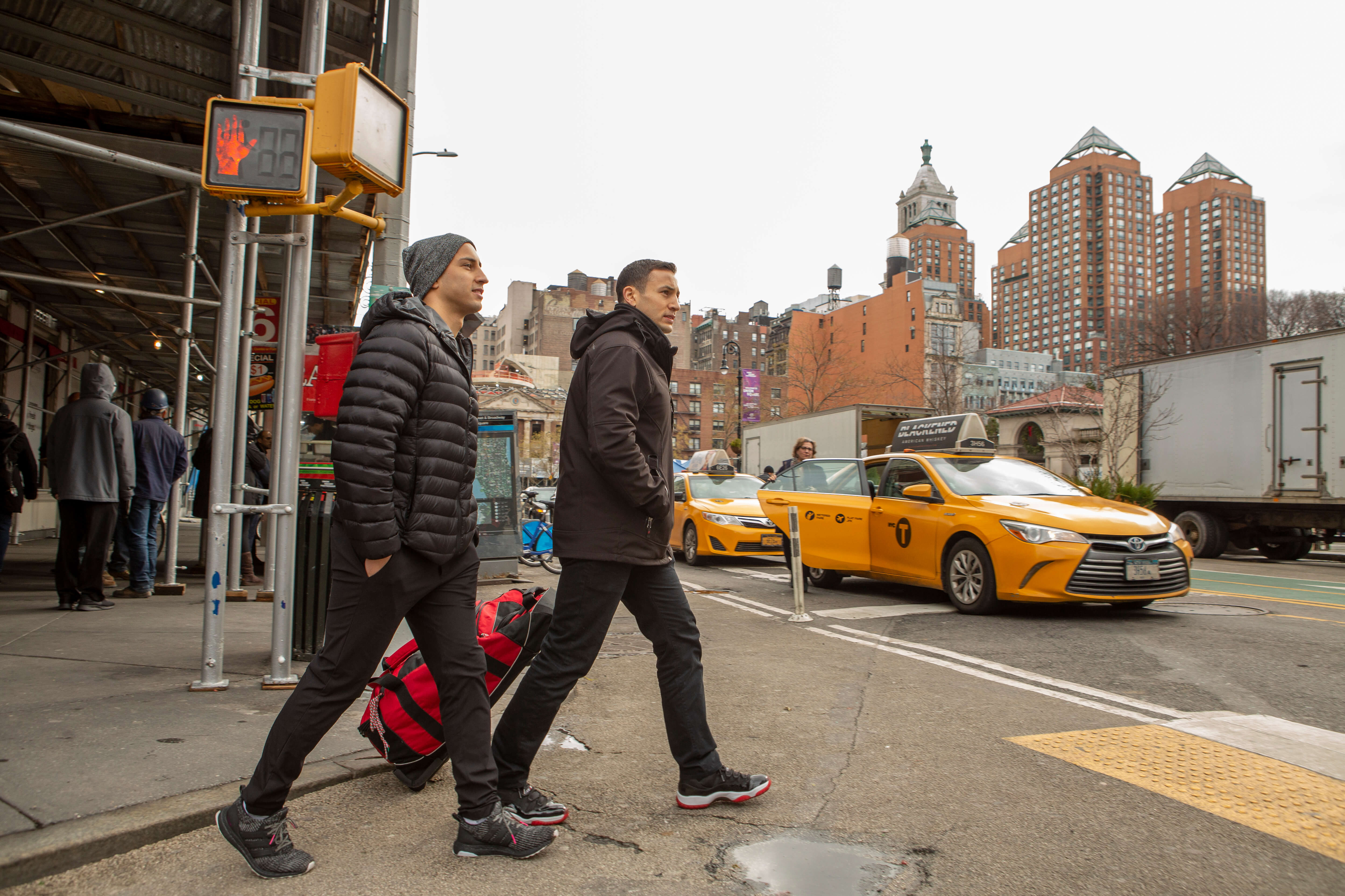 Mike and Nick Fio walking through NYC