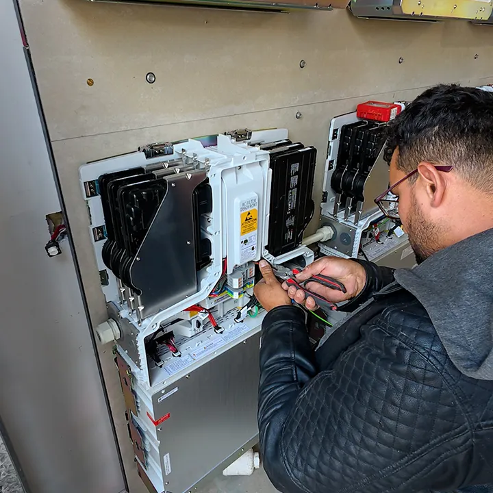Essential Solar installer working on battery