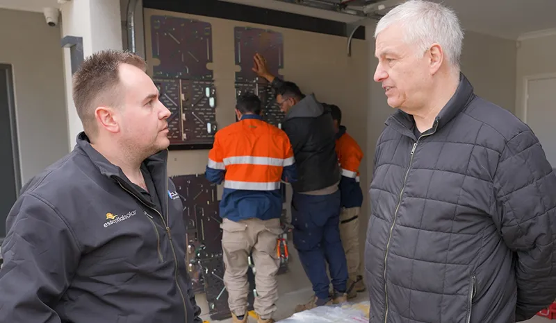 Essential Solar's Sam speaking with home owner during installation