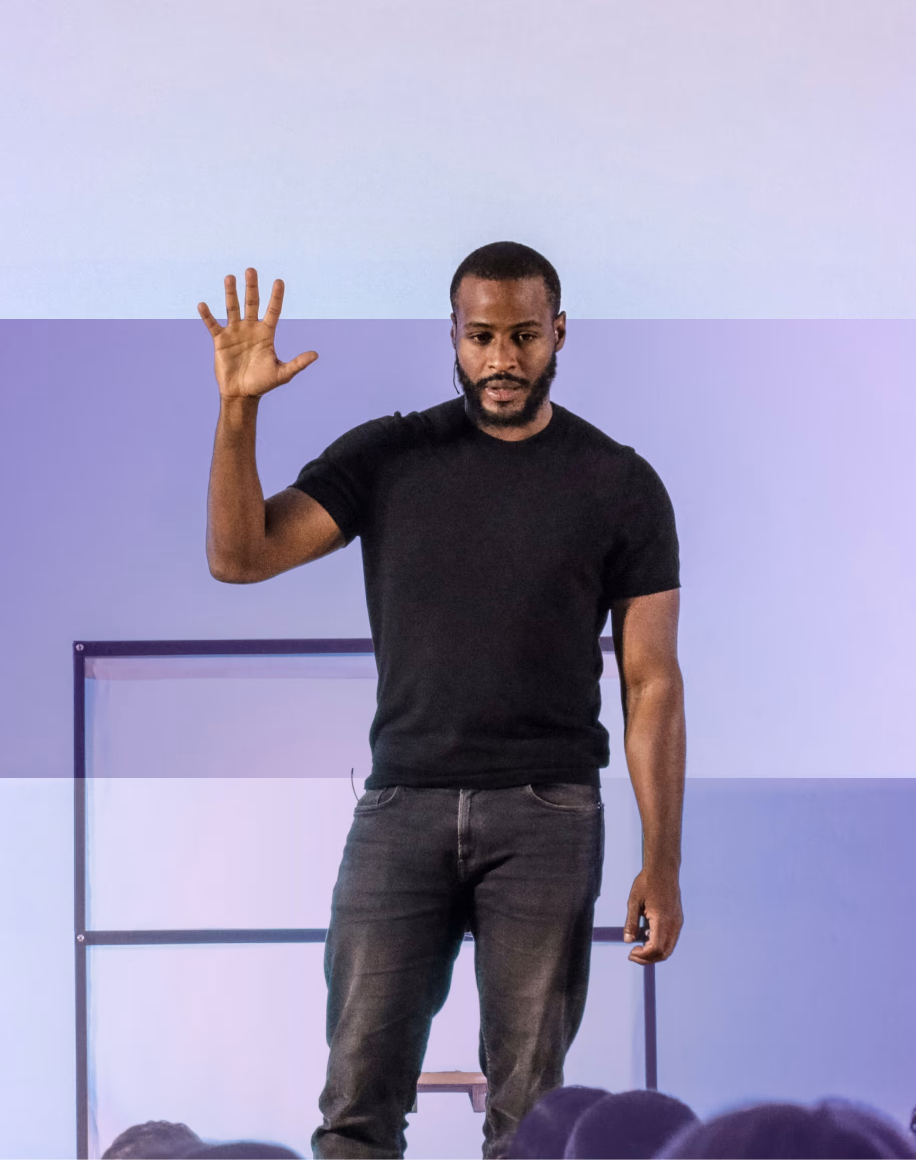 man putting hand up, giving a presentation