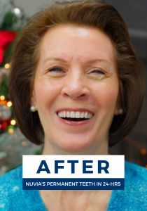 Sandy smiling after getting dental implants