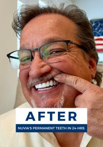 Man smiling after getting dental implants